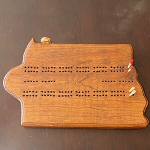 Wooden Cribbage Board with Pegs shaped like the state of Iowa. Great gift!!